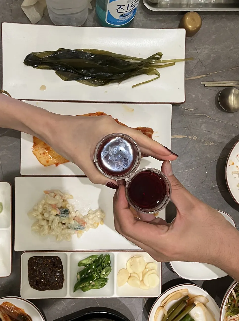 Bottles of bokbunja and soju set on the table