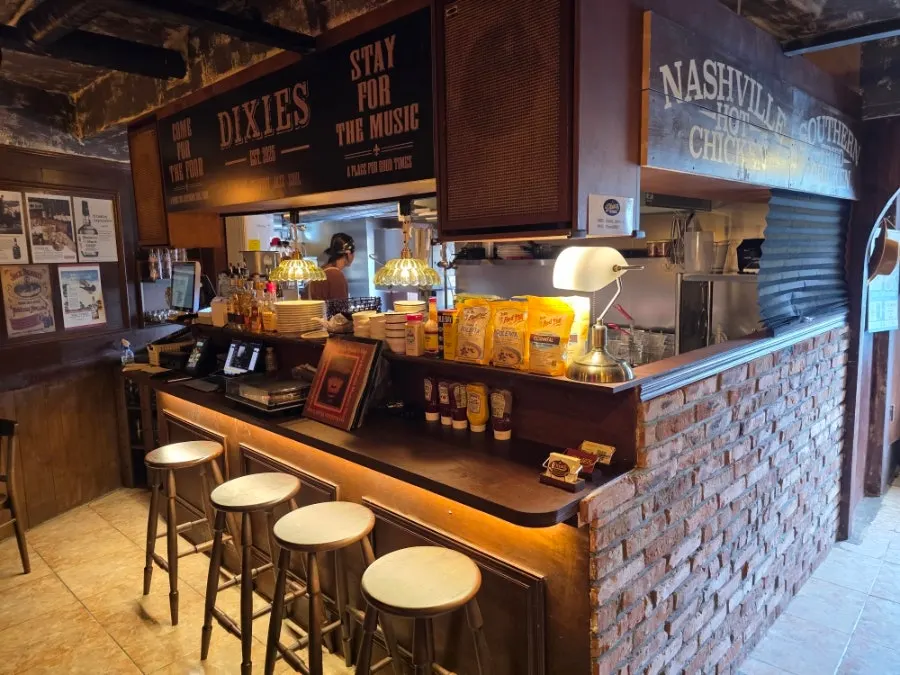 Dixie's bar counter lined with liquor bottles