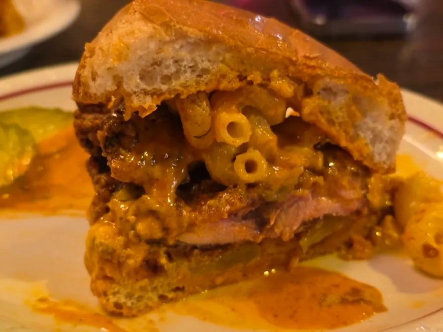 Cross-section of the hot chicken burger with melted mac and cheese