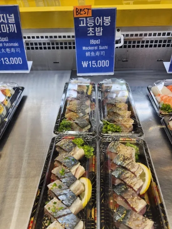 Display counter with sushi price tags at Dutumhoe