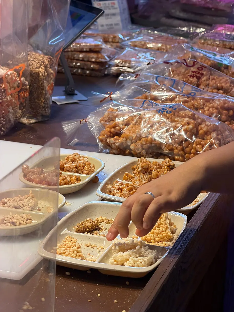 Display case of traditional Korean snacks with a nutty aroma