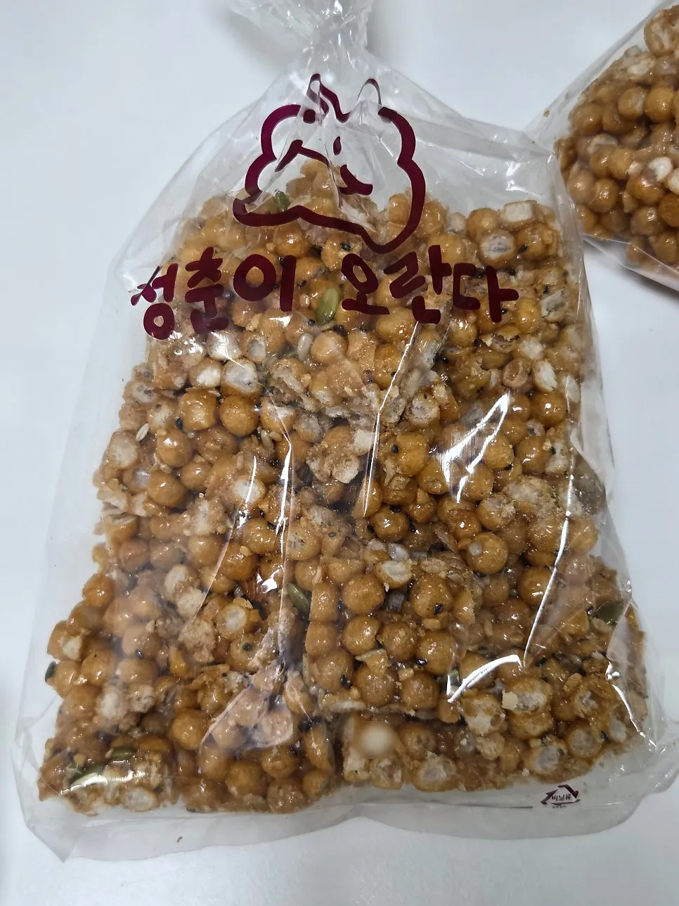 Vertical shot of the oranda bag mixed with black sesame and seeds