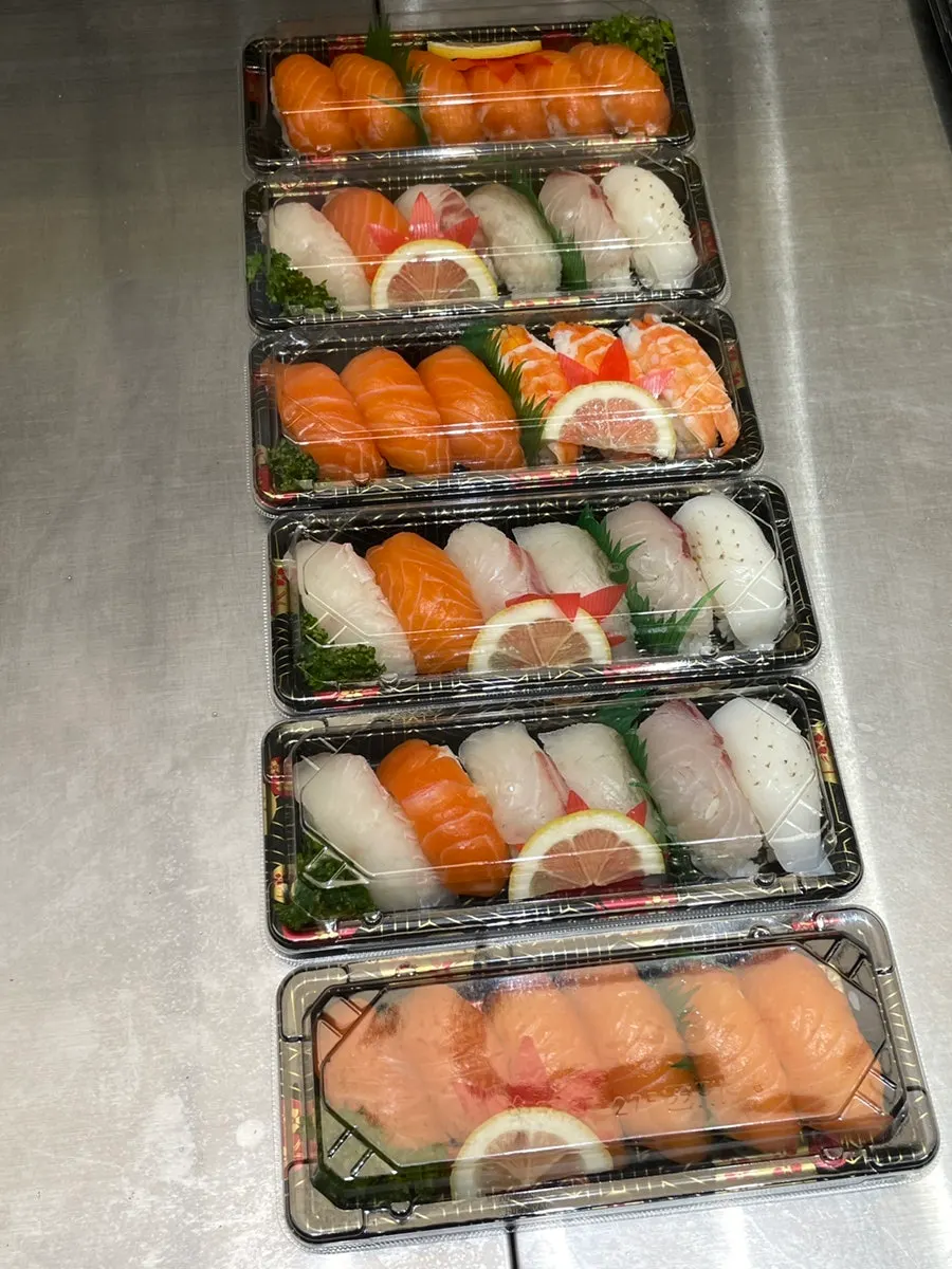 Sushi packed in takeaway boxes on display