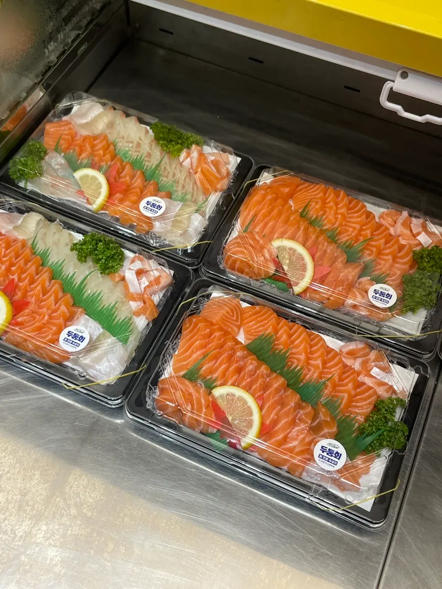 Flounder, salmon and other sashimi displayed for takeaway