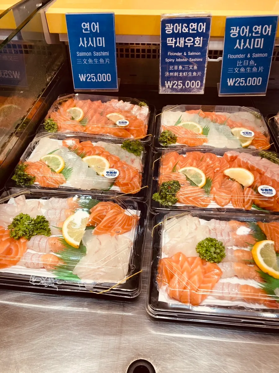 Display case of sashimi and sushi for takeout at Dutumhoe