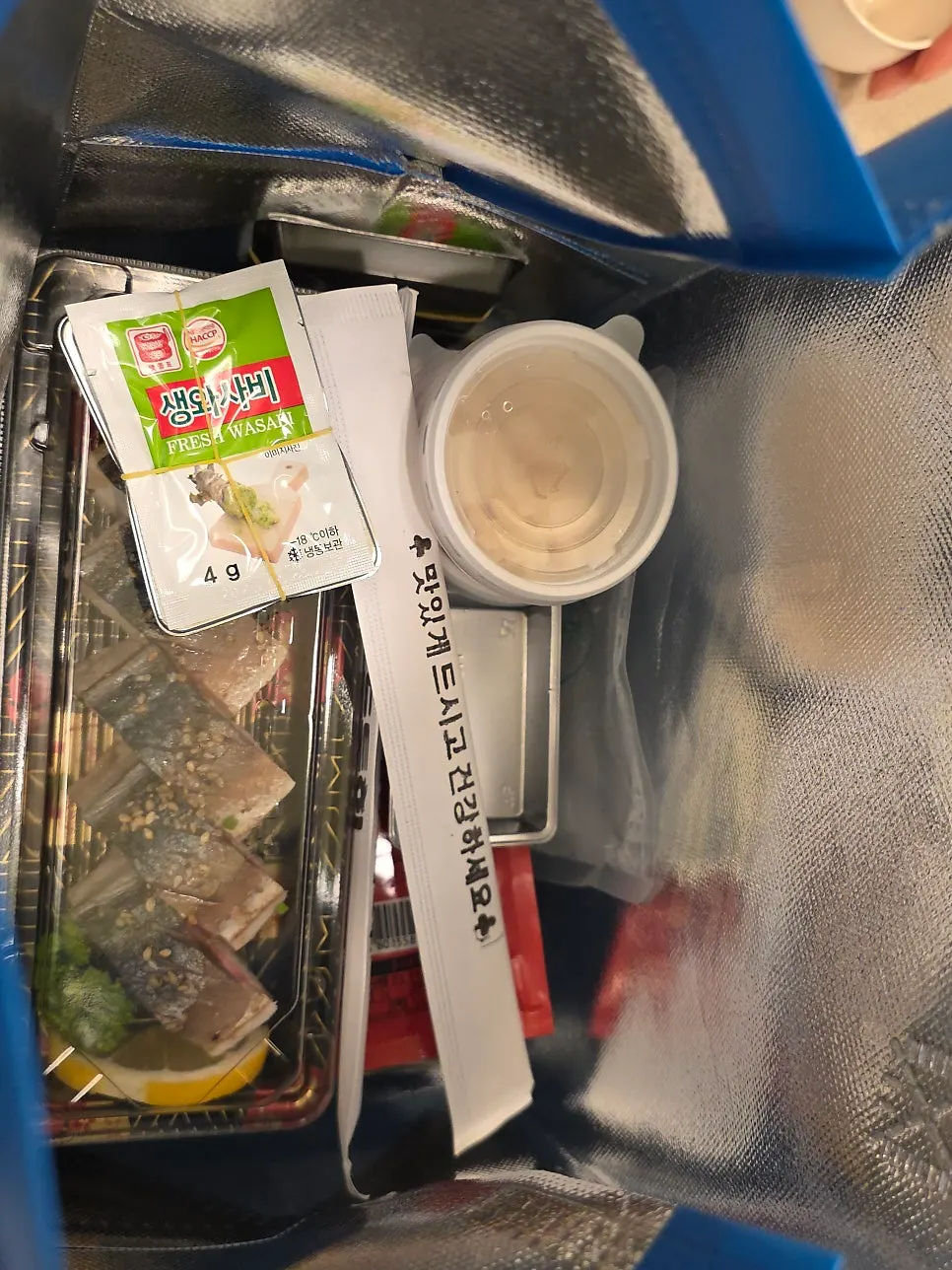 Side dishes included with the takeaway sashimi