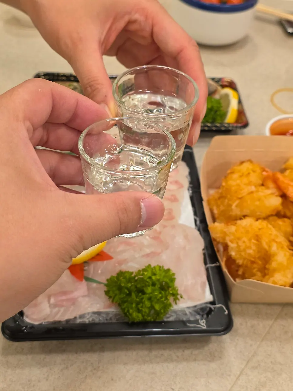 Accommodation meal with sashimi and soju