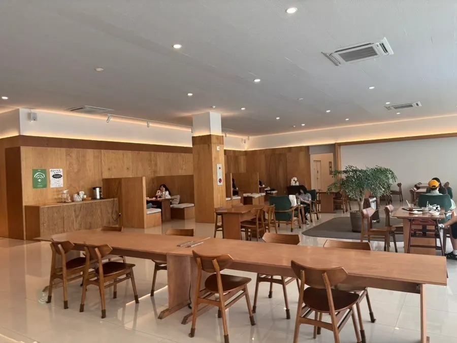 Wood-toned seating inside Dobana