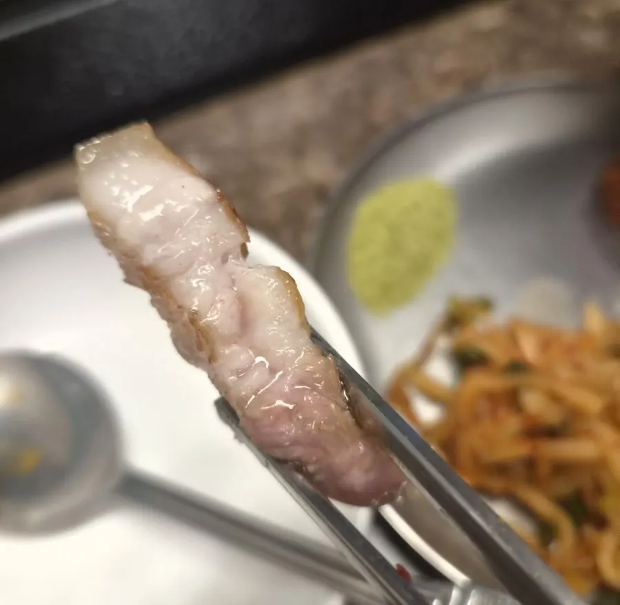 Black pork grilled directly over charcoal