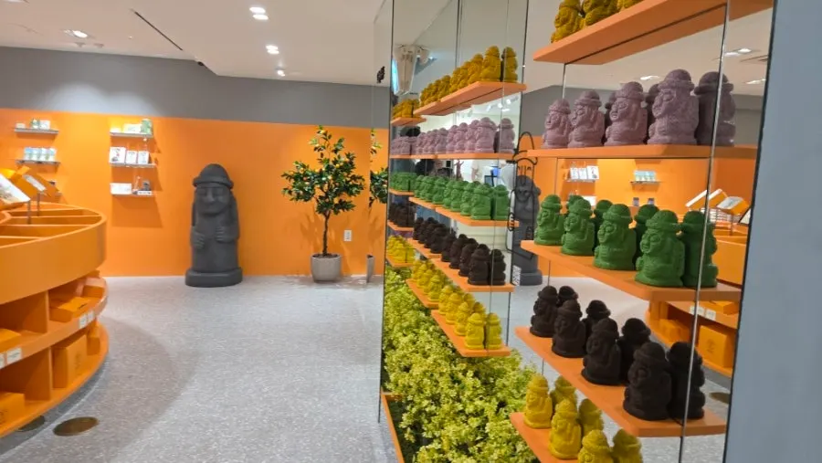 Dol hareubang statue with a tangerine tree pot