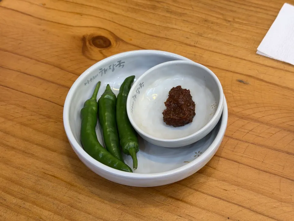 Chili peppers and ssamjang served as basic side dishes