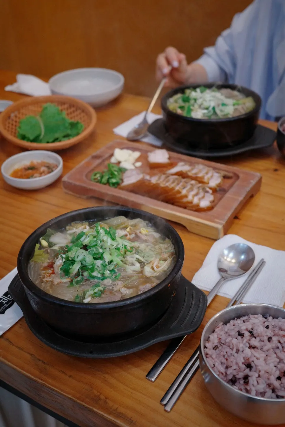 Vertical photo of the table set with dombe pork