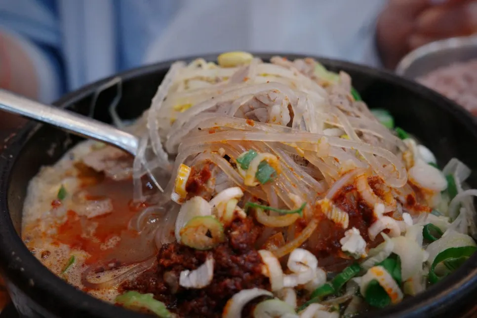Haejangguk ingredients lifted up with a spoon
