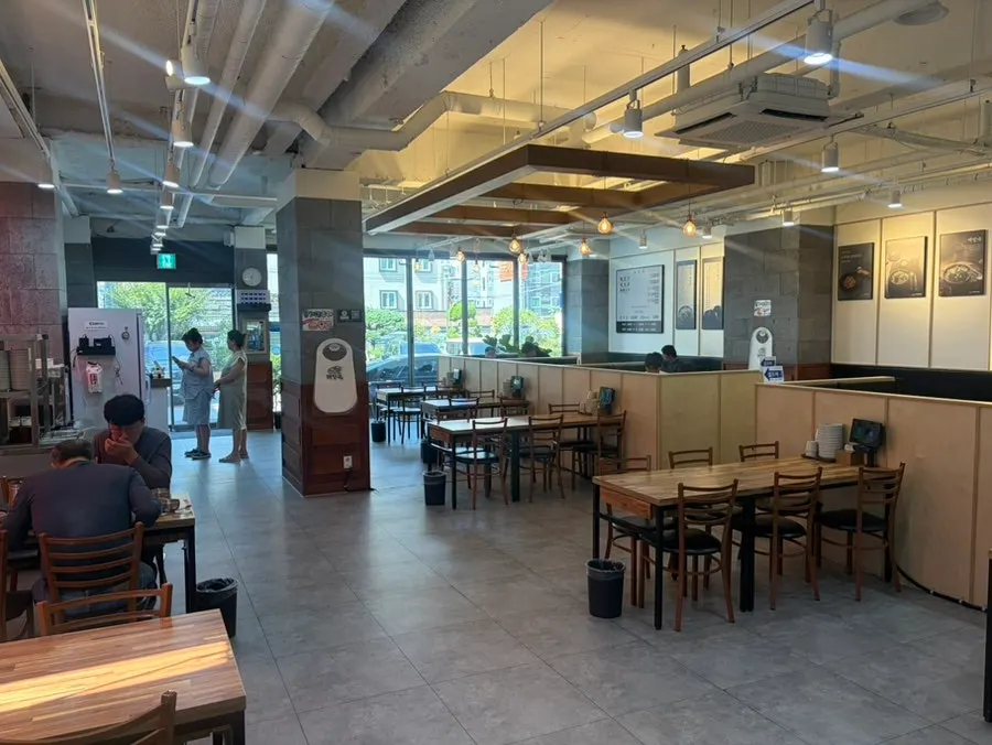 Open kitchen where cooking is visible