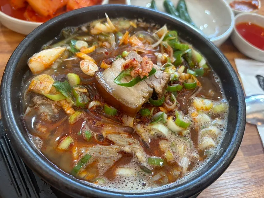 Jeju-style haejangguk bubbling in a stone pot