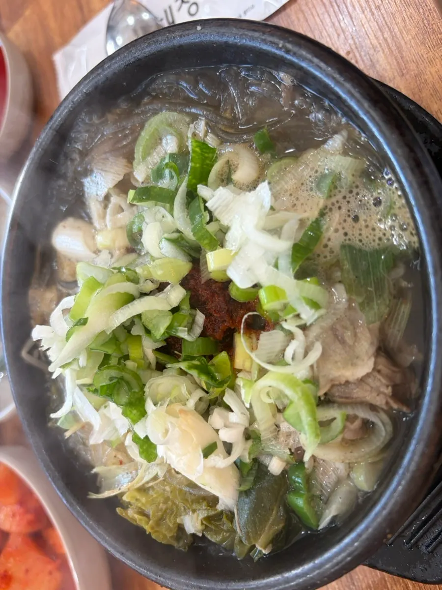 Haejangguk stone pot topped with a generous pile of scallions