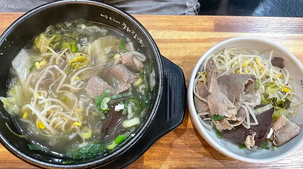 A bowl of haejangguk loaded with ingredients