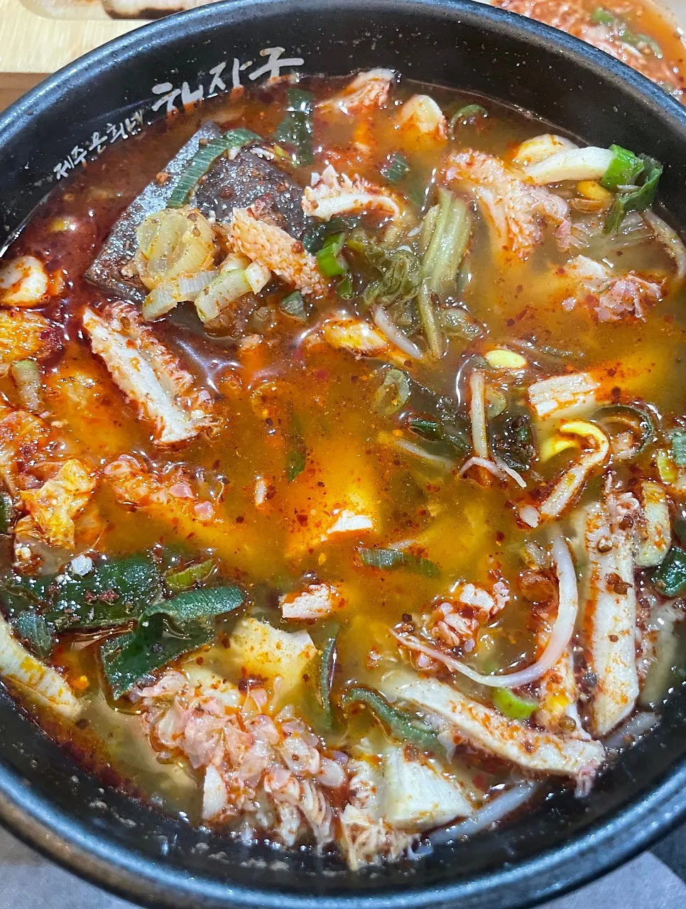 Red broth base of the tripe soup