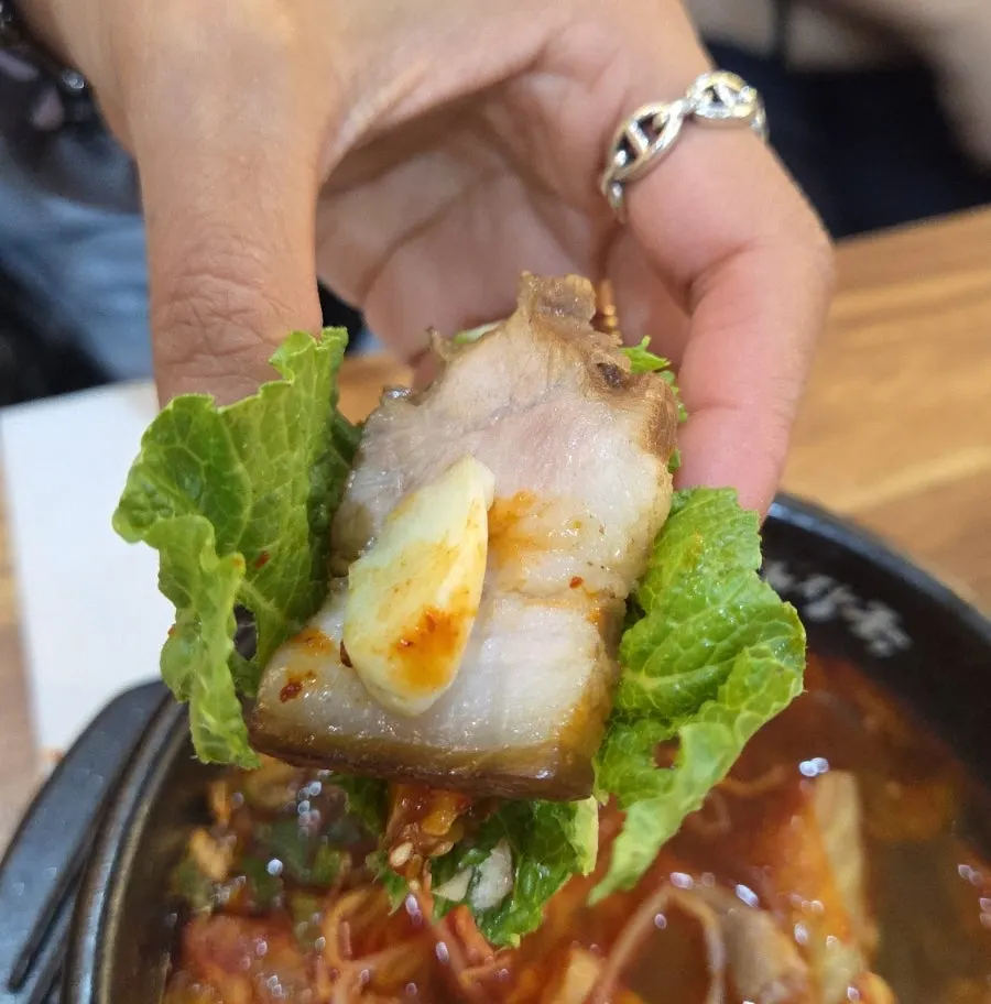 Dombe pork wrapped in cabbage leaf