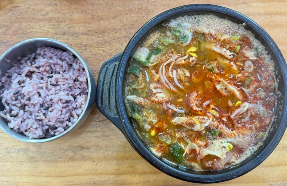 Full table setting with dombe pork and haejangguk