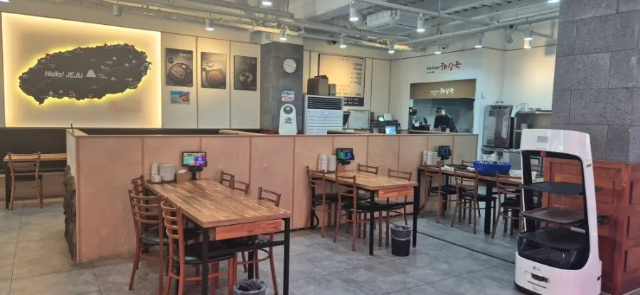 Spacious wood-tone interior of the restaurant