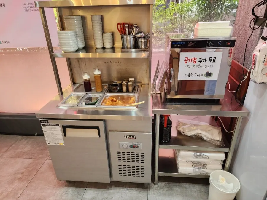 Self-serve bar with side dishes and seasonings