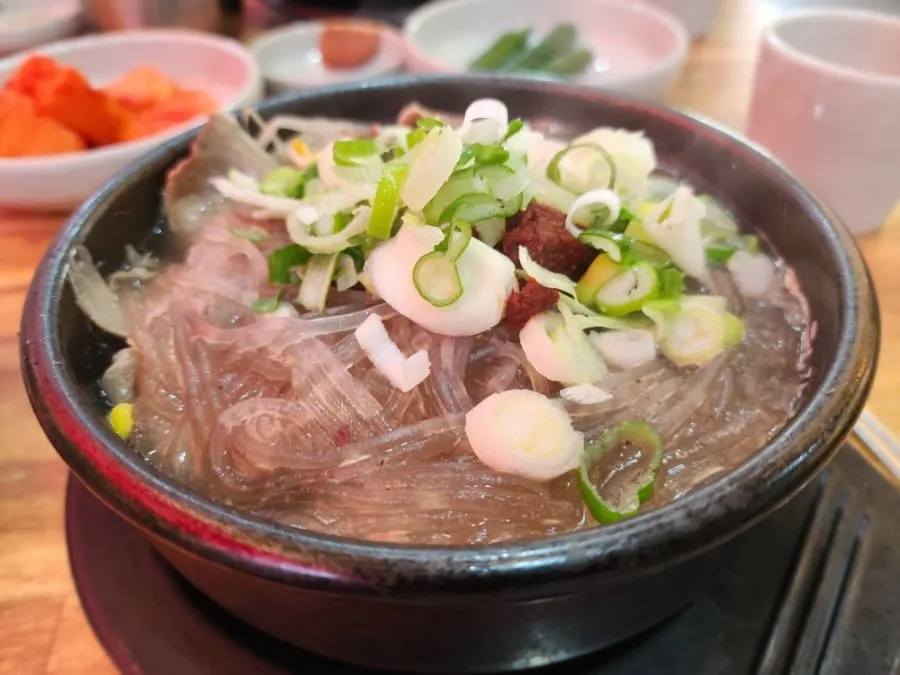 Full spread of haejangguk with rice and basic side dishes