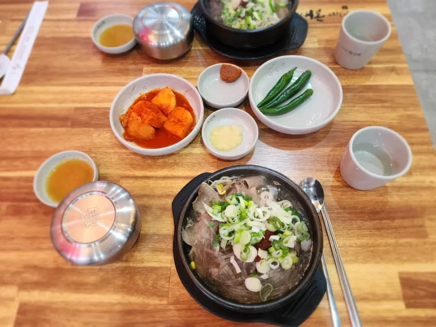 Stone bowl of haejangguk topped with plenty of green onion