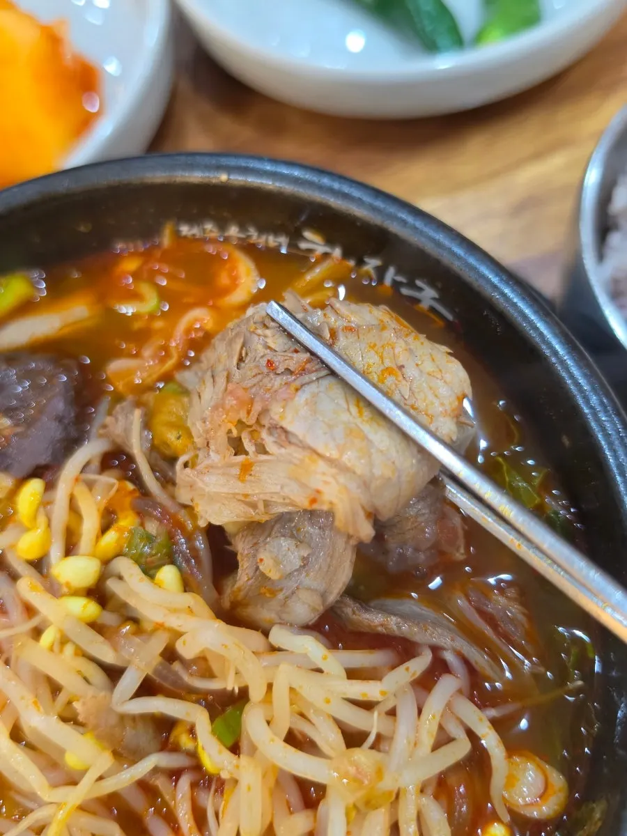 Glass noodles soaked in broth inside the haejangguk