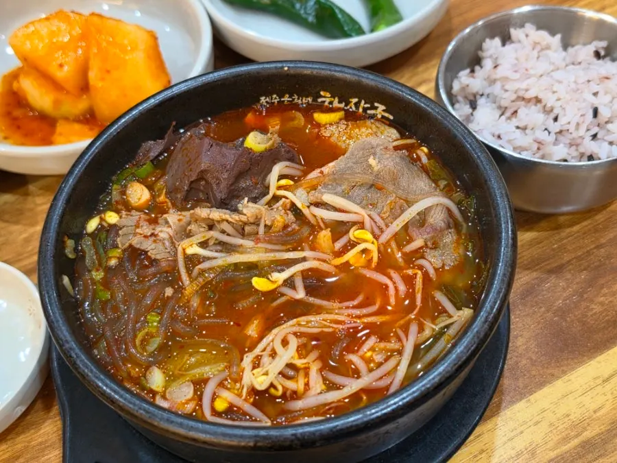 Spicy haejangguk broth with minced garlic added