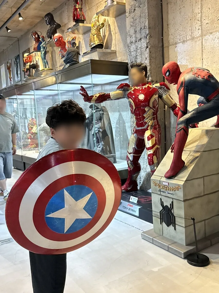A child lifting a prop