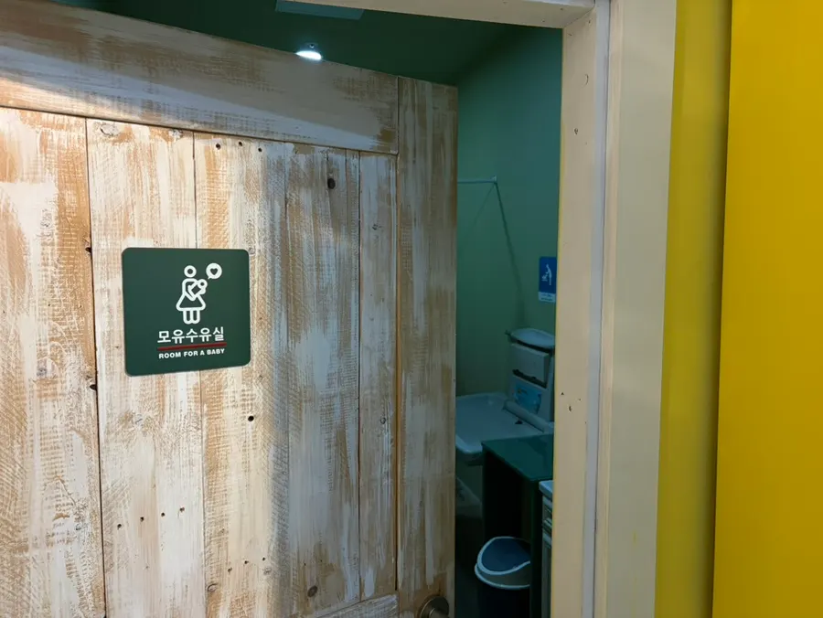 An indoor Jeju attraction visited with a child
