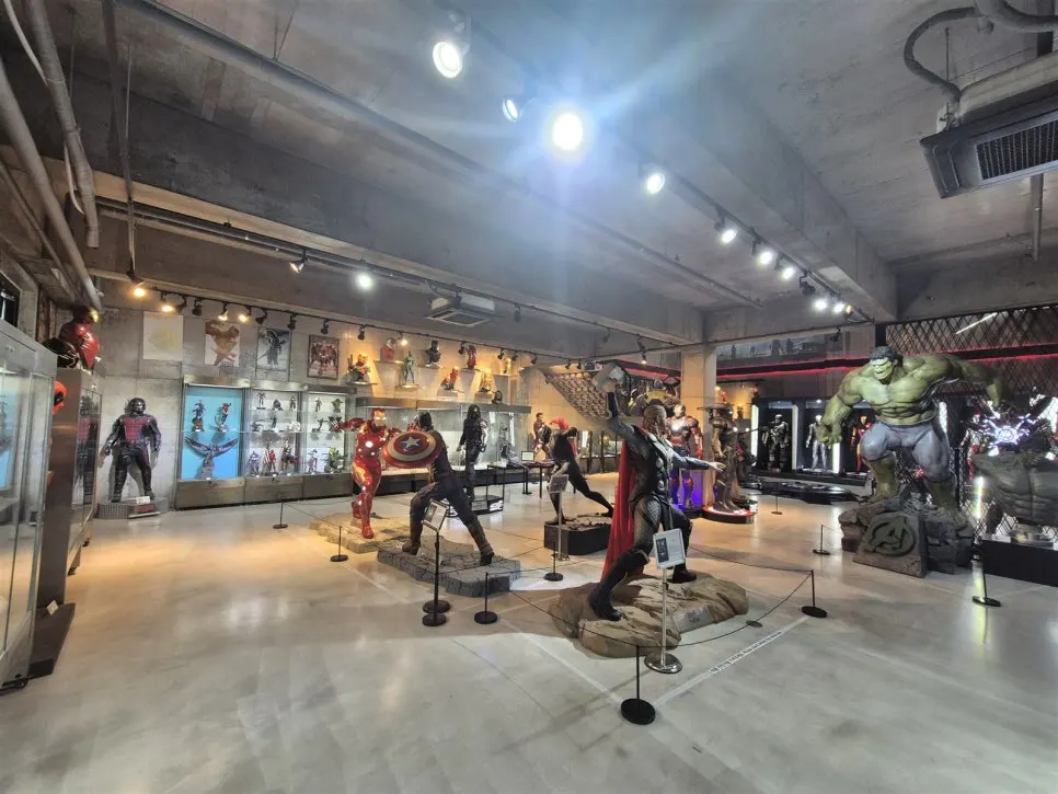 Spacious exhibition hall with Marvel characters and display cases