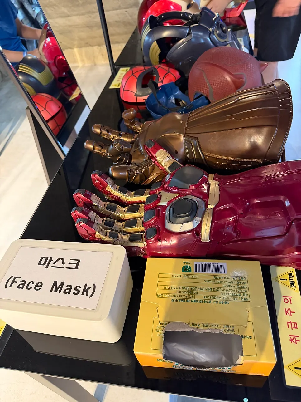 Try-on corner with gauntlets, shields, swords, and masks