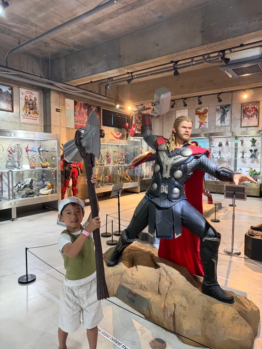 Trying on movie hero props