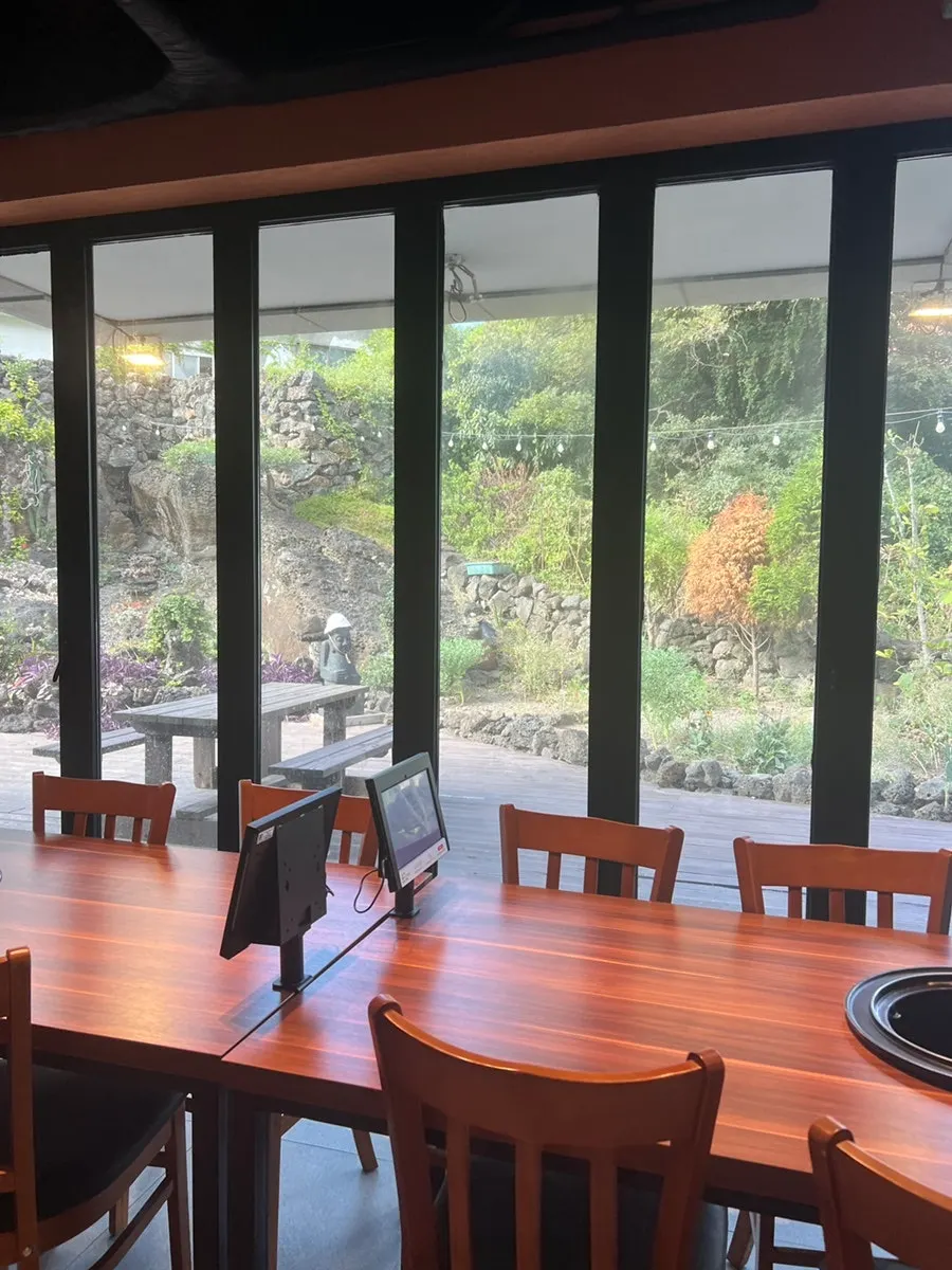 Spacious, clean interior of Jeju Samchun black pork restaurant