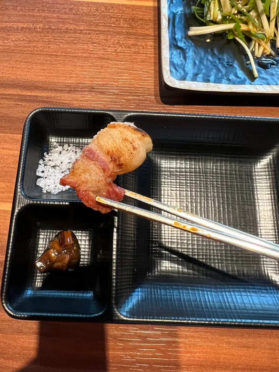A thick-cut piece of grilled black pork