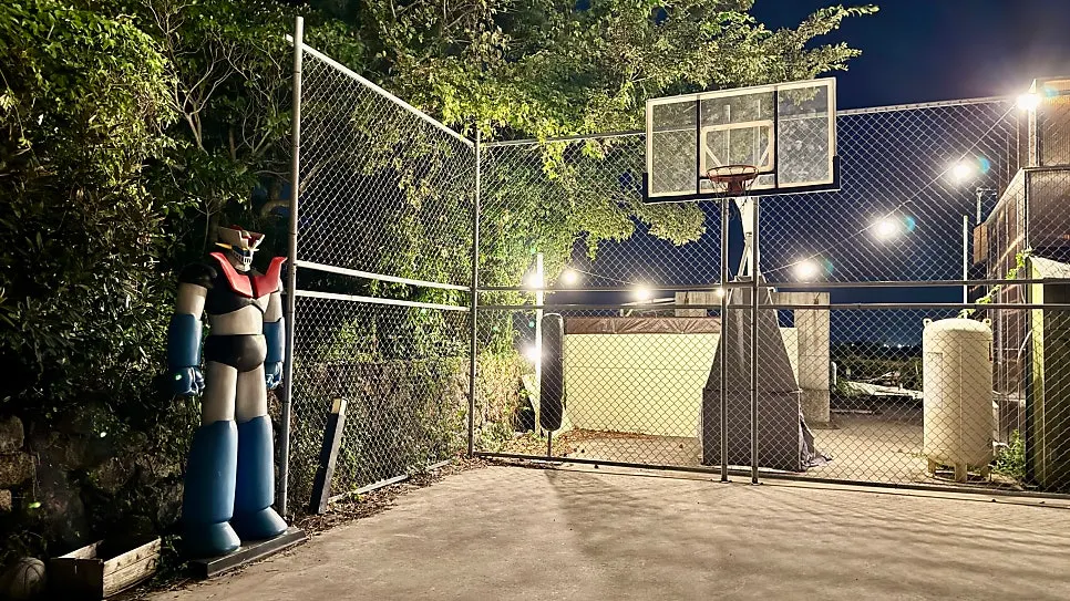 A basketball court inside the guesthouse