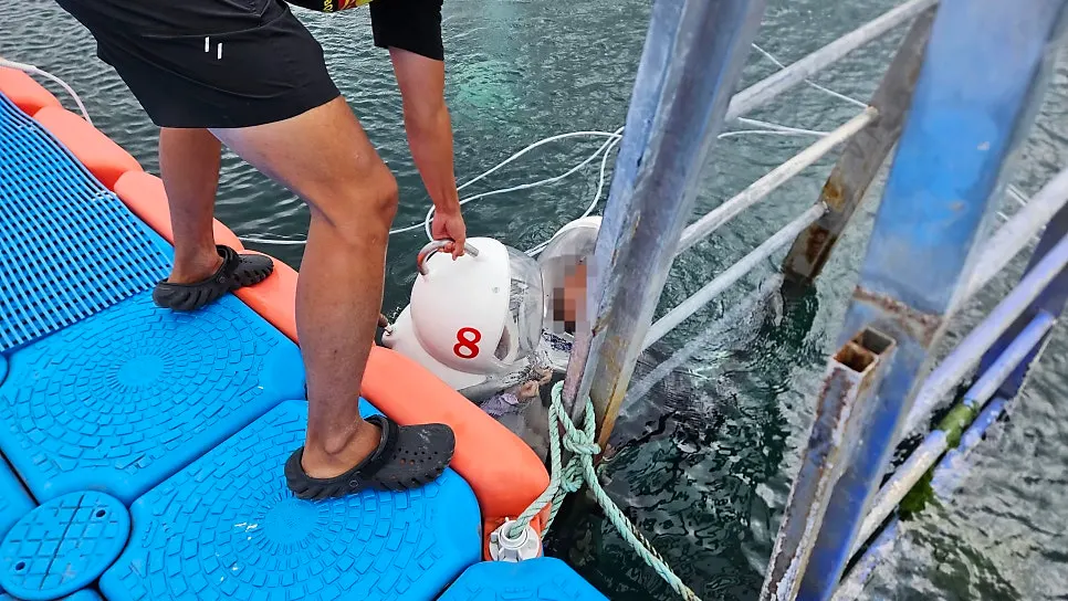Wearing Underwater Play's in-house sea walking helmet
