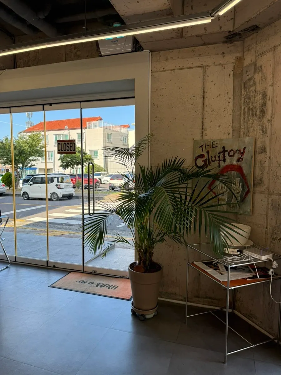 Seating area at Gluttony Coffee with customers seated