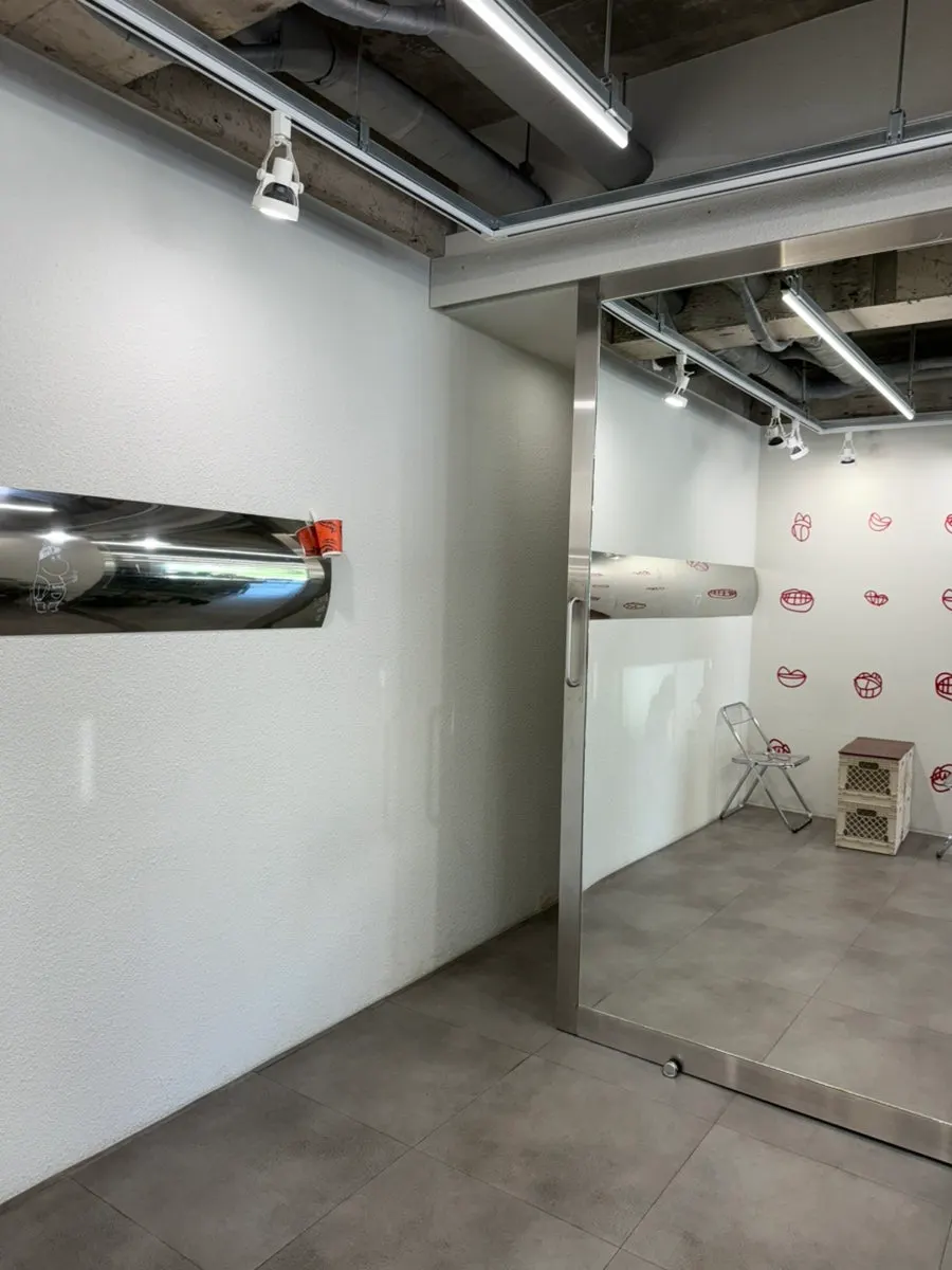 Interior passage pointing toward the restroom