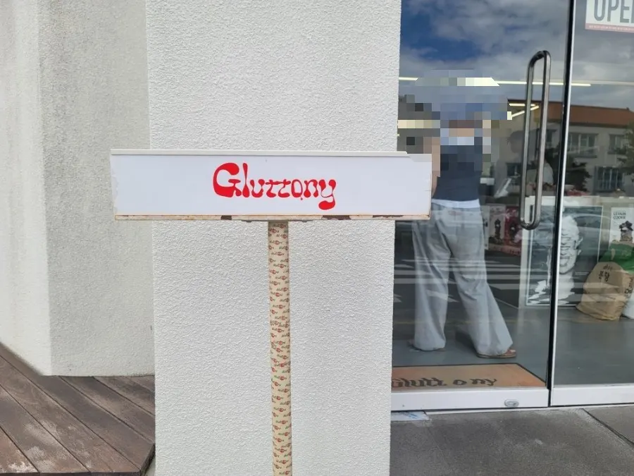 Modern monochrome exterior of Gluttony Coffee