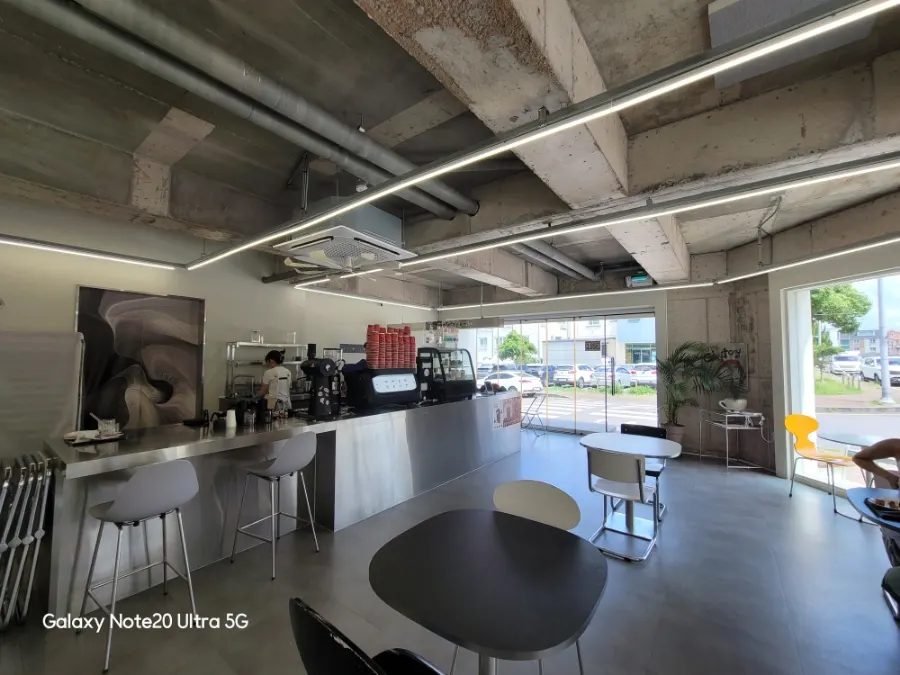 Interior with exposed concrete and a steel counter bar