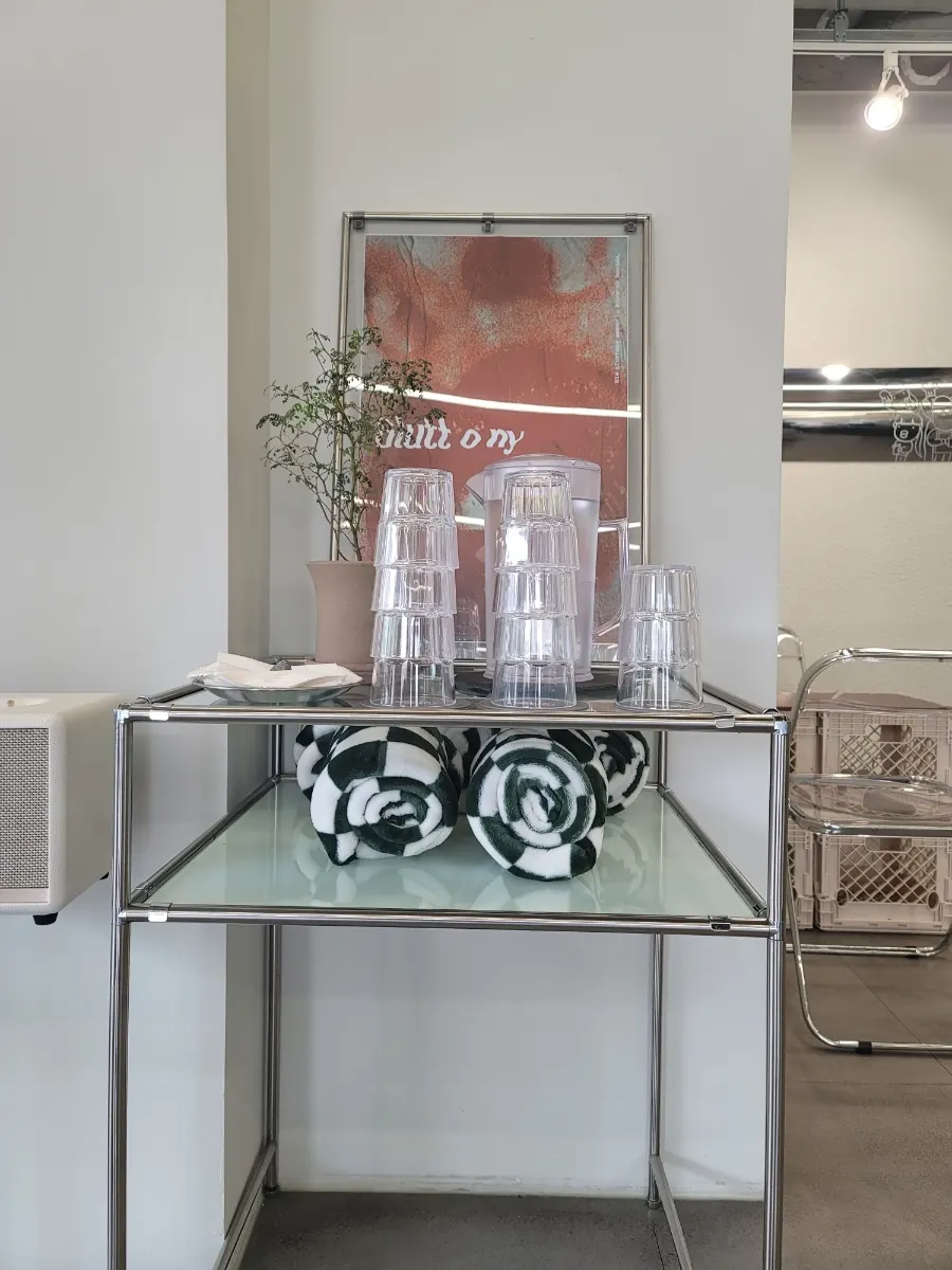 Self-serve bar with water, cups, and knee blankets