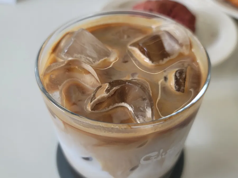 Signature Gluttony latte showing milk layers