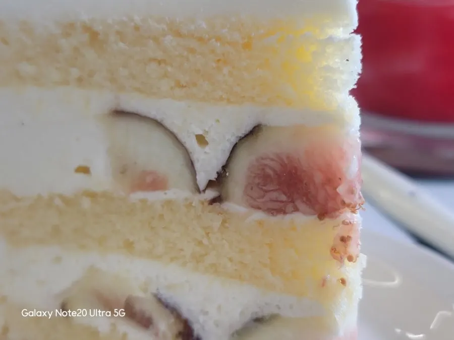 Seasonal fig cream cake topped with fresh figs