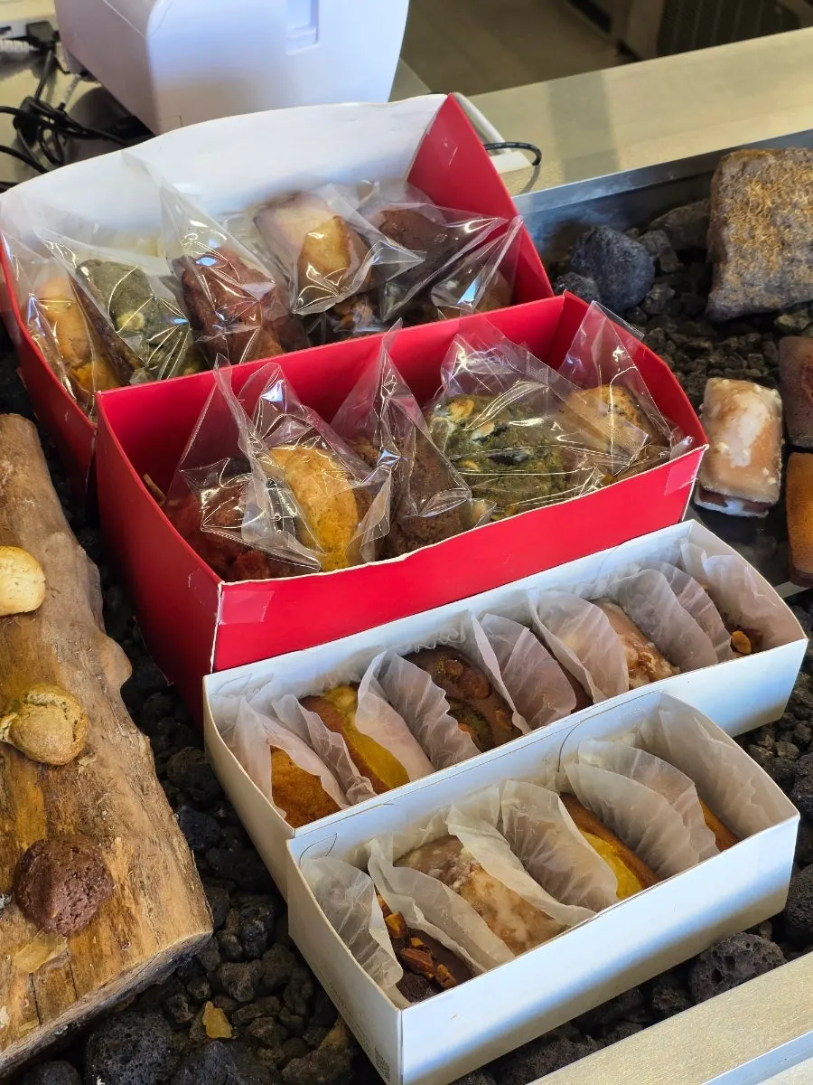 Dessert display with canelé, financiers, and levain cookies