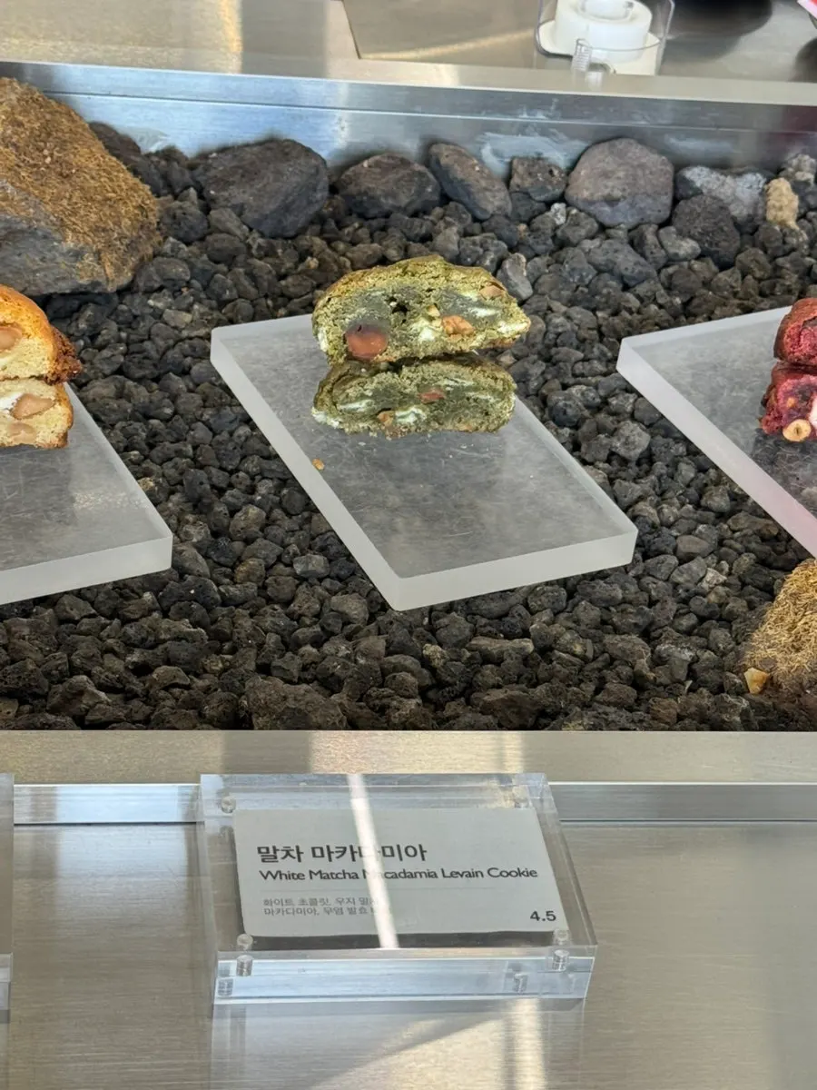 Deciding which levain cookie to pick at Gluttony Coffee's display case