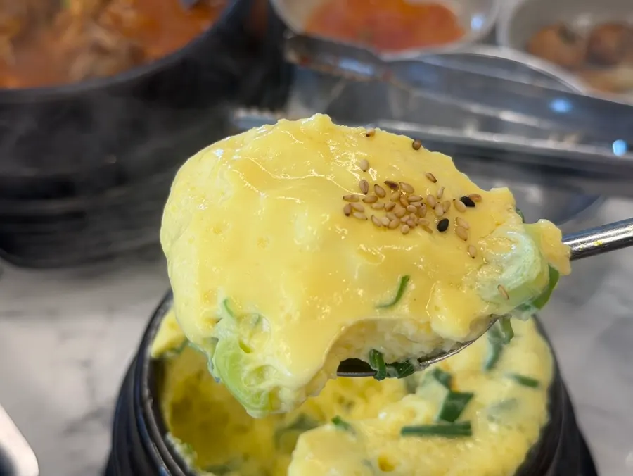 Full spread with meat, stew, and steamed egg all served