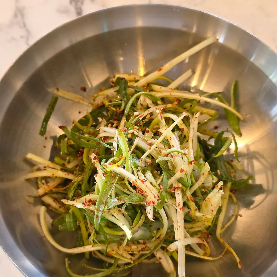 Shredded scallions and wrap vegetables among the side dishes